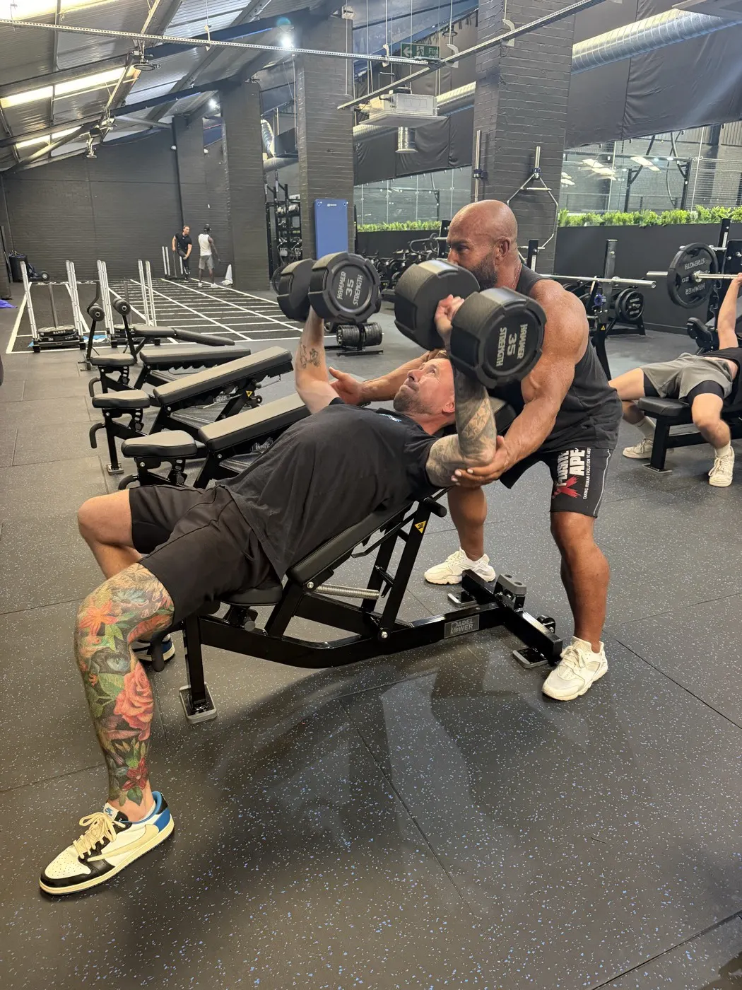 A personal training session on the gym floor