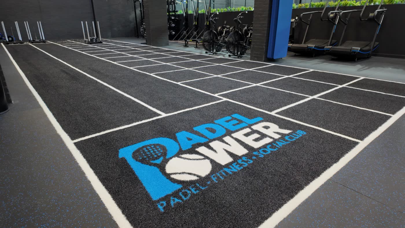 Padel Power logo on the turf track in the HYROX zone