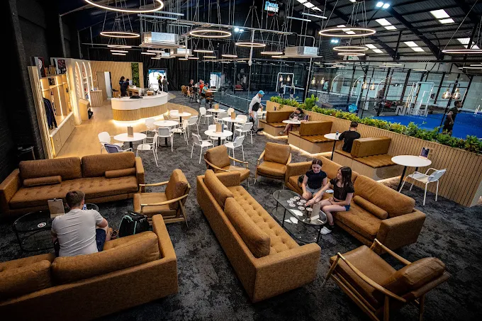 The lounge with leather sofas overlooking the courts