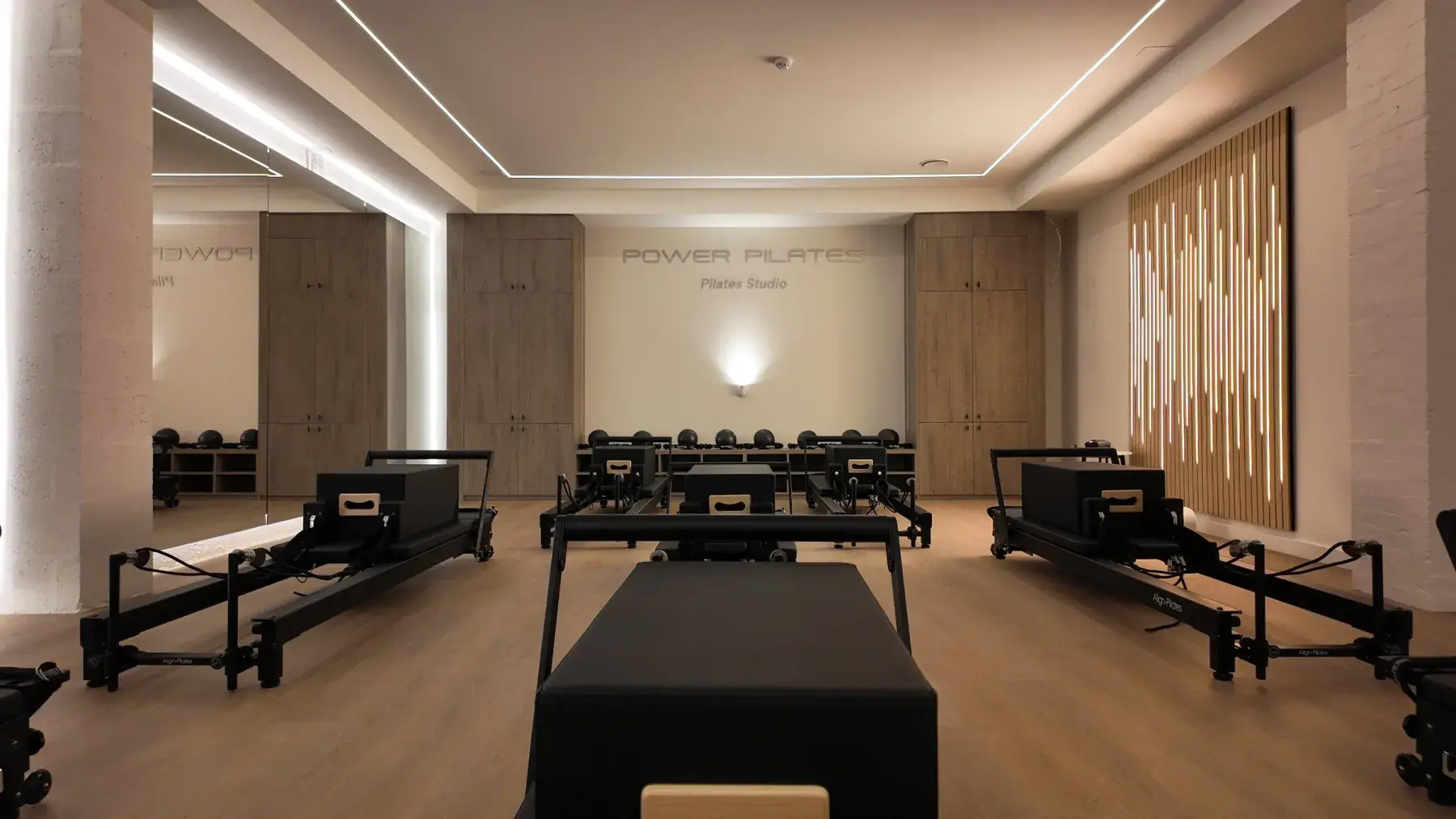 The Power Pilates studio with its reformer beds