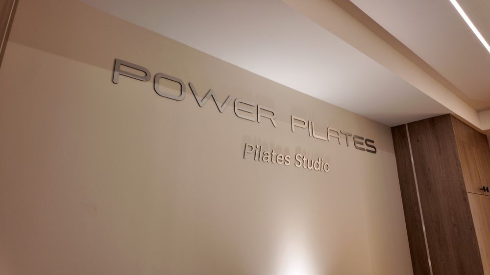 Power Pilates studio sign on the wall