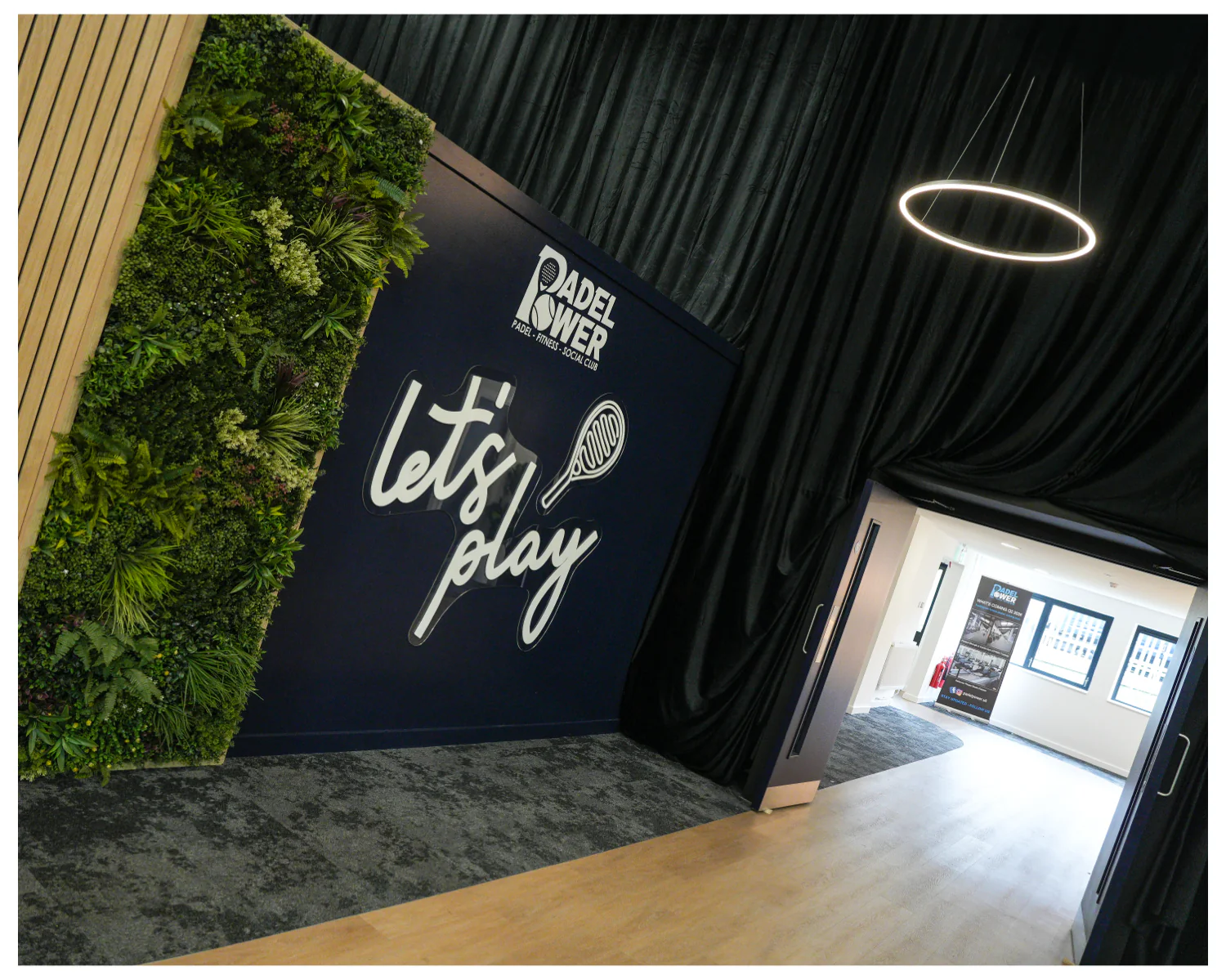 The let's play sign on the living wall