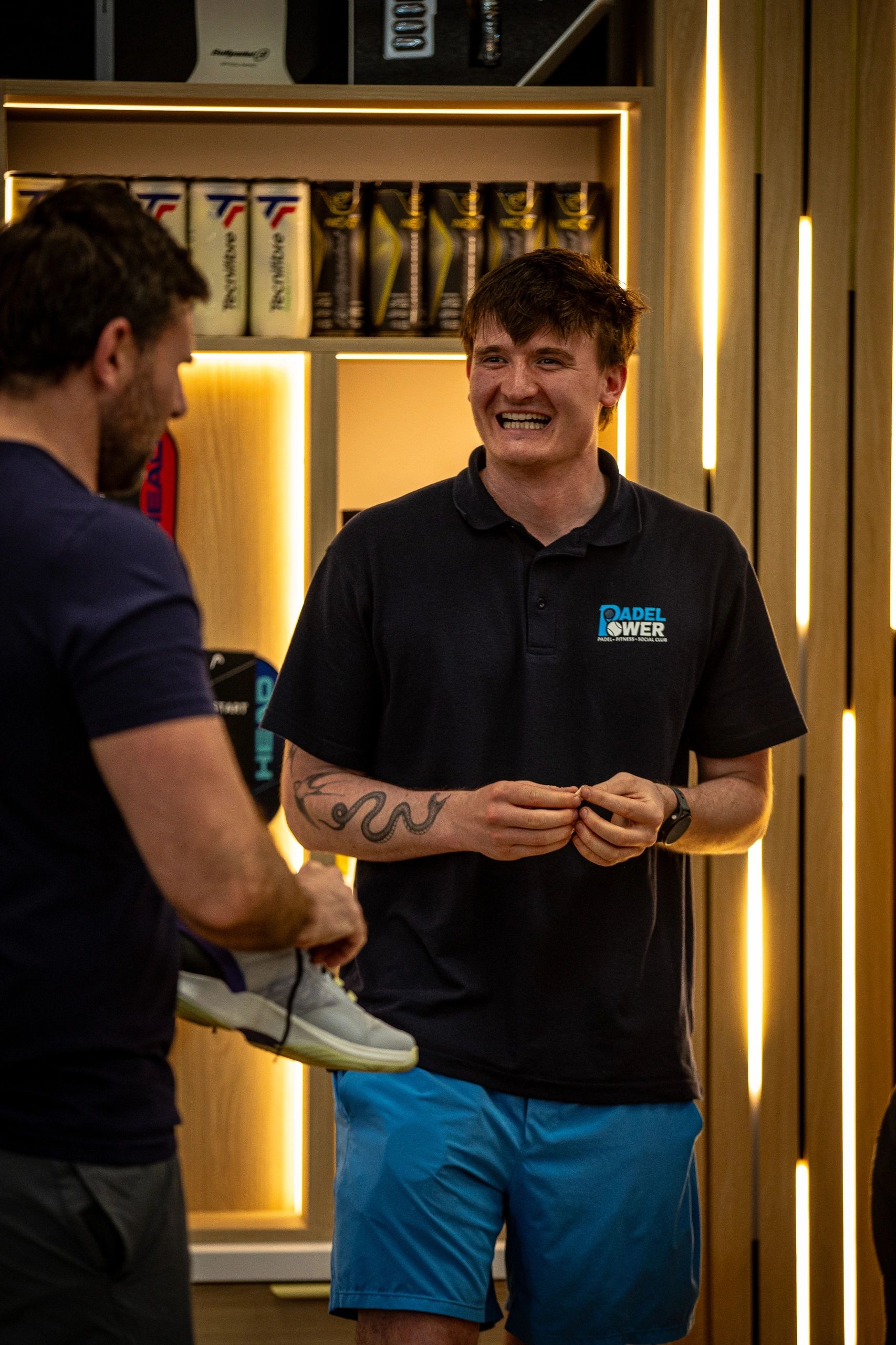 Staff helping a customer in the pro shop